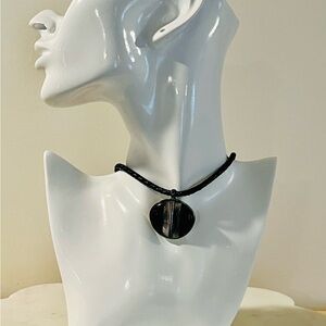 Monet black lucite abalone inlay pendant on learner braided cord.